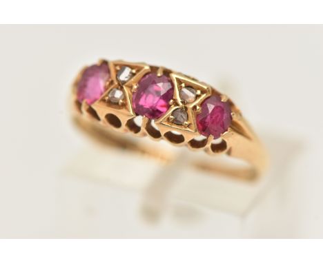 AN EARLY 20TH CENTURY 18CT GOLD RUBY AND DIAMOND RING, set with three oval cut rubies, interspaced with four rose cut diamond