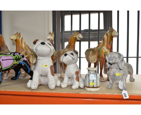 A GROUP OF ORNAMENTAL ANIMALS to include a composite graffiti-patterned British bulldog, two weighted bulldog door stops, sev