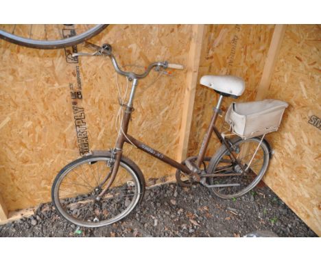 A HALFORDS NIMBUS 508 BIKE with an 18in frame, rear rack and vinyl basket, dynamo powered rear light (condition report surfac