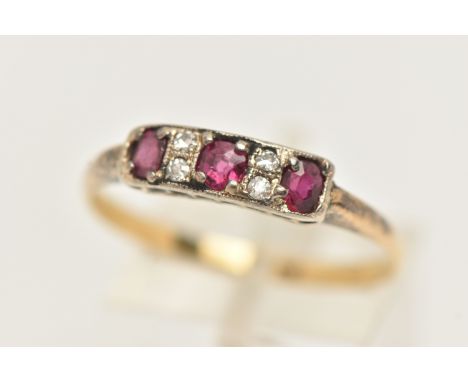 A YELLOW METAL RUBY AND DIAMOND RING, ring head of a rectangular form set with three oval cut rubies, interspaced with four s