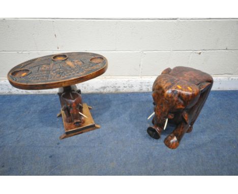 A HARDWOOD SIDE TABLE IN THE FORM OF AN ELEPHANT, width 25cm x depth 39cm x height 41cm, along with another elephant table, w