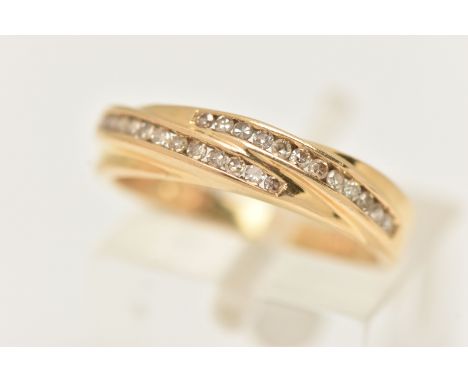 AN 18CT YELLOW GOLD DIAMOND BAND RING, the ring is of cross over design set with a total of approximately twenty four single 