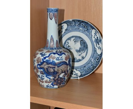 TWO PIECES OF CHINESE PORCELAIN, comprising a blue and white central dragon design plate with a floral border, six blue Chine