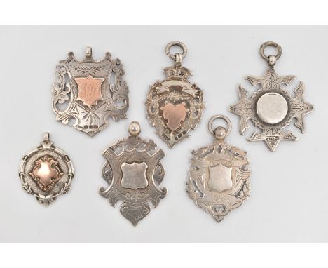 A SMALL BAG OF SILVER FOB MEDALS, six in total, various styles and shapes, all with vacant cartouches, two with rose metal ca