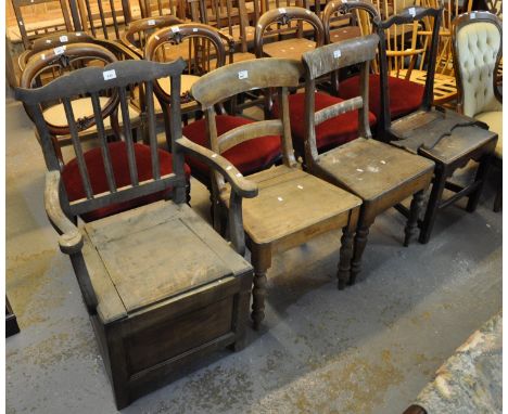 Collection of four 19th Century oak farmhouse chairs, to include; one commode armchair. (4)(B.P. 21% + VAT) In distressed con