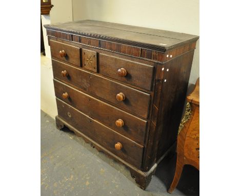 19th Century oak and mixed woods inlaid straight fronted chest of three short and three long drawers, with turned handles on 