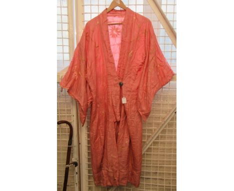 1920'S pink silk kimono with flowers hand embroidered in wool and cherub design metal button with fastening. (B.P. 21% + VAT)
