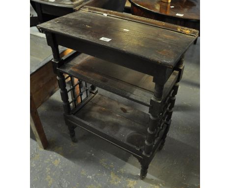 Edwardian style stained two tier trolley or side table on wheels, the side panels with lattice decoration and bobbin turned s