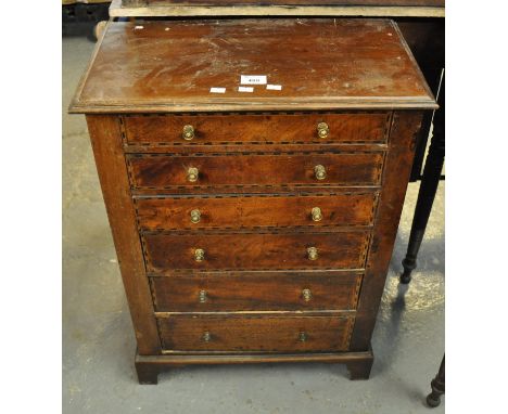 19th Century mahogany and mixed woods inlaid narrow straight front chest of six drawers with turned brass handles on bracket 