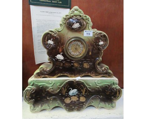 Early 20th Century painted pottery clock on matching base, hand painted with swans on a lake amongst reeds.(B.P. 21% + VAT) 