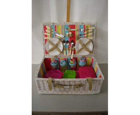 A fitted wicker picnic hamper