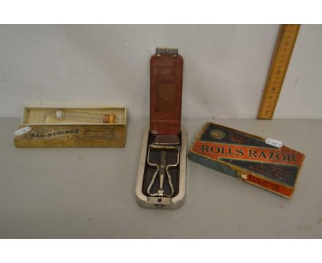 Vintage cased glass ear syringe and a Rolls razor