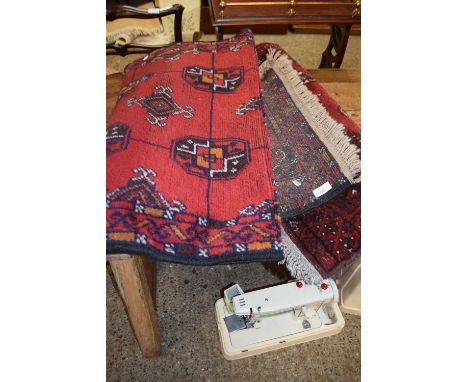 Modern red wool runner carpet together with a further smaller carpet