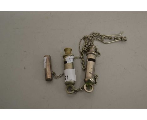 Three vintage whistles to include The Metropolitan