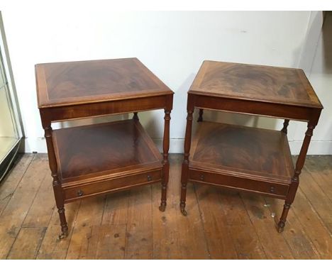 A pair of Georgian inspired mahogany lamp tables, the crossbanded tops on turned supports above a lower tier fitted single fr
