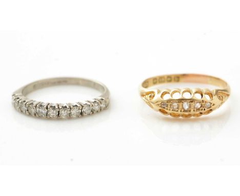 Two diamond rings, one five stone in 18ct gold mount, ring size N, 2.5g gross; and one eleven stone half hoop, in 18ct white 