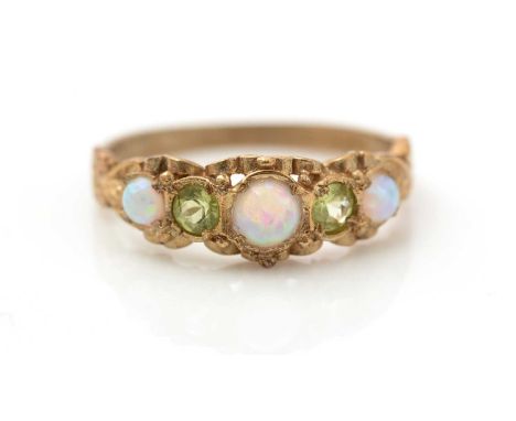 An opal and peridot ring, in 9ct yellow gold floral mount and shank, ring size O, 2.4g gross.