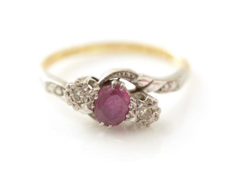 A ruby and diamond ring, the oval facet cut ruby flanked by eight-cut diamonds in an illusion platinum mount and 18ct gold sh