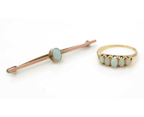 A five stone opal ring, on 18ct gold shank ring size N, 2.8g gross; and an opal and 9ct gold bar brooch, 2.4g gross. 