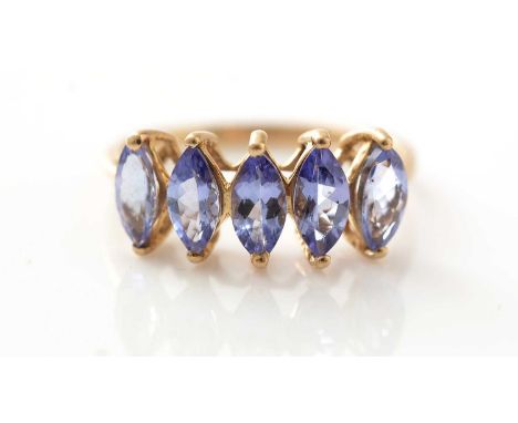 A five stone tanzanite ring, the marquise cut ring in 9ct yellow gold mount and shank, ring size . 