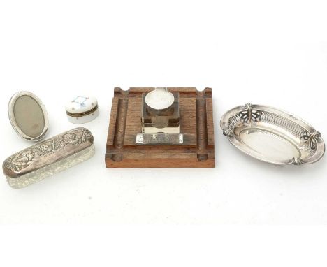 A selection of silver items, including: a cut glass and silver covered pin pot; a bonbon dish; a glass inkwell on oak stand; 