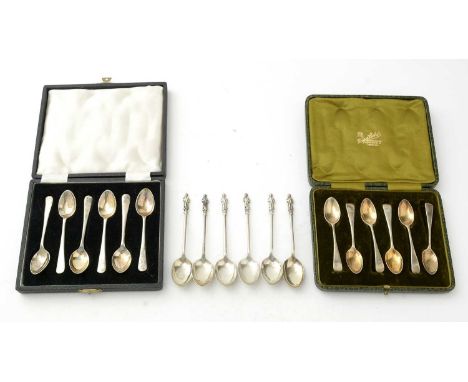 A selection of silver teaspoons, including: six appostle type spoons; two sets of six coffee spoons, cased; 5.2oz gross.