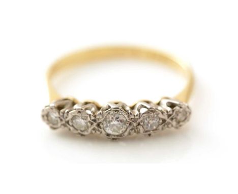 A five stone diamond ring, the graduated old cut diamonds weighing a total of approximately 0.20carats, in white gold mount a