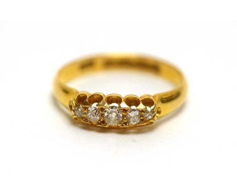 An early 20th Century five stone diamond ring, the five graduated old cut diamonds in 18ct yellow gold mount and shank, size 