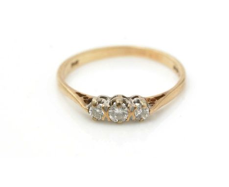 A three-stone diamond ring, 9ct yellow gold mount and shank, ring size K.