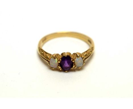 A 9ct gold amethyst and opal three-stone ring, size O 1/2, 2.4g gross.