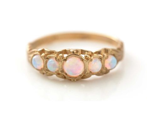 A five stone opal ring, the circular cabochons in 9ct gold scrolls and shank, ring size N 1/2, 2.3g gross.