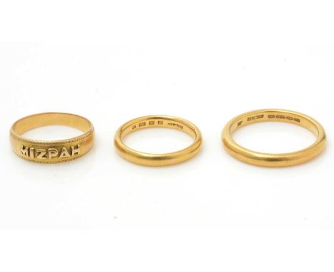 Two 22ct yellow gold wedding bands, 11.2g gross; and an 18ct yellow gold Mizpah ring, 3.5g.
