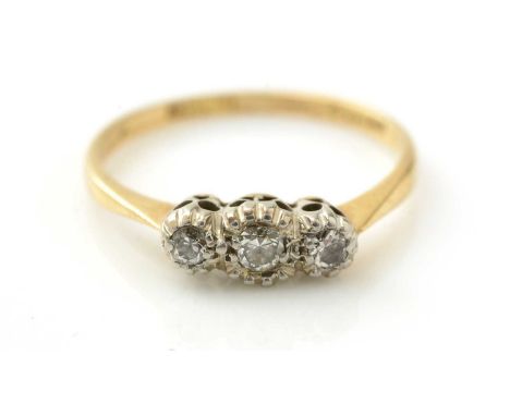 A three stone diamond ring, in platinum mount and 18ct gold shank, ring size K, 1.7g gross.