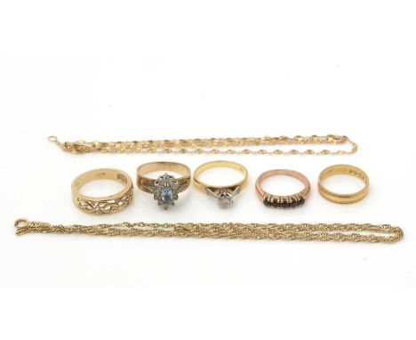 A diamond ring, on 18ct gold shank; and 18ct gold wedding band, 5.6g gross; three other rings with 9ct gold shanks and two go