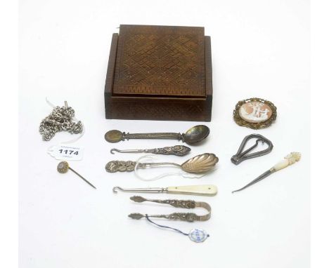 A chip-carved box containing silver and costume jewellery, including a silver "Albert" watch chain; a gilt-metal and micromos