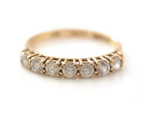 A seven stone CZ ring, in 9ct yellow gold mount and shank, ring size .