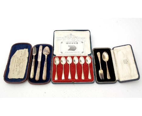 A silver three piece christening set, by H J Lias &amp; Son, London 1864, cased; a silver Christening spoon and fork, by Josi