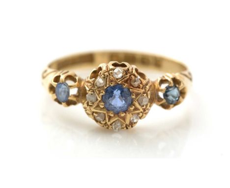 An Edwardian spinel and diamond ring, the central cluster flanked by blue spinel shoulders, 18ct yellow gold mount and shank,