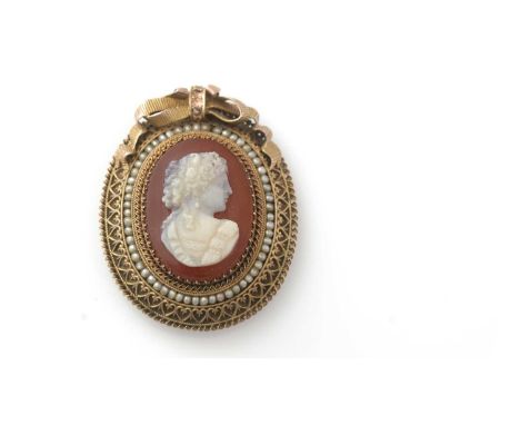 A carved agate hardstone cameo brooch, the carved female bust within gold and seed pearl mount, approximately 14ct, with bow 