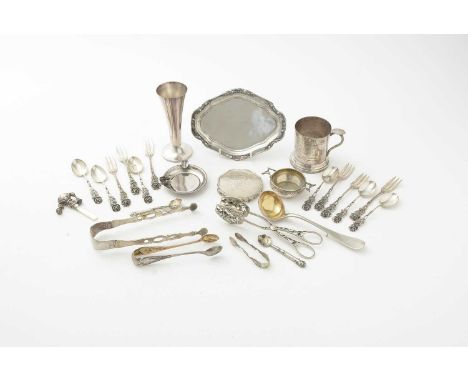 A selection of Continental silver, including: German teapot stand, tongs with gilt interior, two handled table salt; a pair o