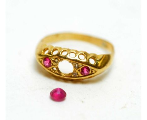 An early 20th Century ring, the central loose stone pink spinel, flanked by diamonds and rubies, in 18ct yellow gold mount an