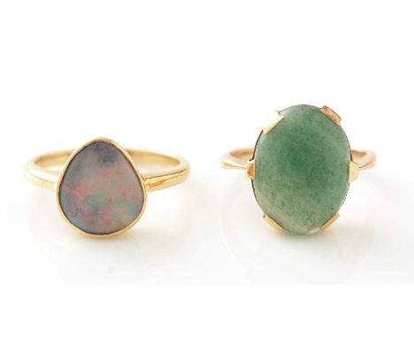 An opal ring, the oval opal cabochon, in 18ct yellow gold mount and shank; and an aventurine quartz ring, the oval cabochon a