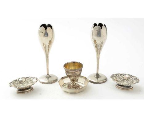 A selection of silver items, to include: vases, a dish, and egg cup and two embossed bonbon dishes. 