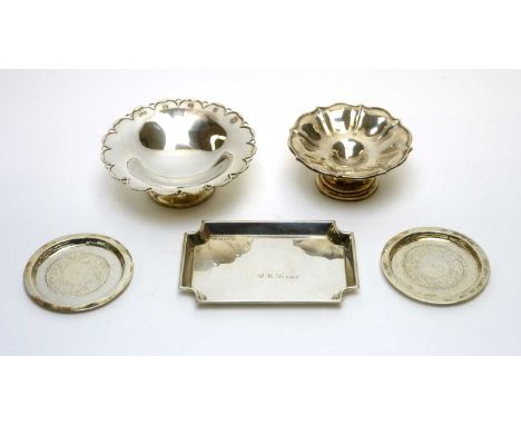 A silver dish, by Mappin &amp; Webb; another by Walker &amp; Hall; a canted rectangular dish, by A C Bloxham Ltd; and two cir