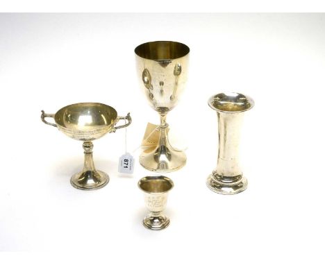 A silver chalice cup, with presentation inscription, 6.2oz; a silver trumpet vase, 2.3oz; a two handled trophy by Asprey, 3.4