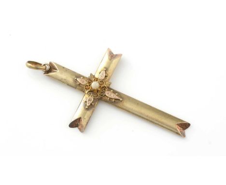A crucifix pendant, approximately 18ct gold, with seed pearl set to centre, 4.4g gross.