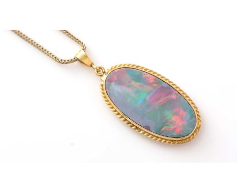 An opal pendant, the oval opal probably doublet, in 18ct yellow gold mount, on 9ct yellow gold chevron link chain, 7.4g gross