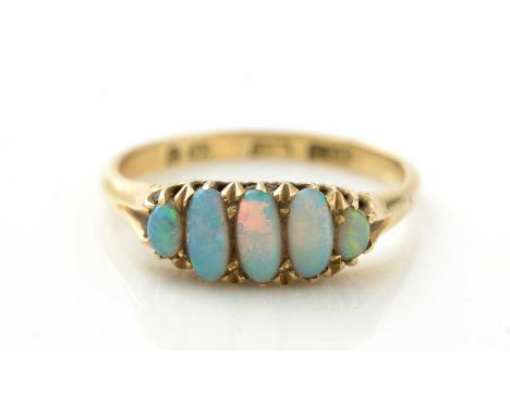 A late Victorian five stone opal ring, the graduated oval opal cabochons in 18ct yellow gold mount and shank, ring size N, 3.