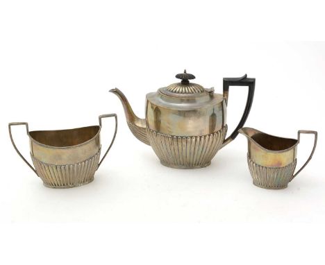 A three piece silver tea service, by James Deakin &amp; Sons, Sheffield 1909, of half fluted form, 33.6oz. gross. 
