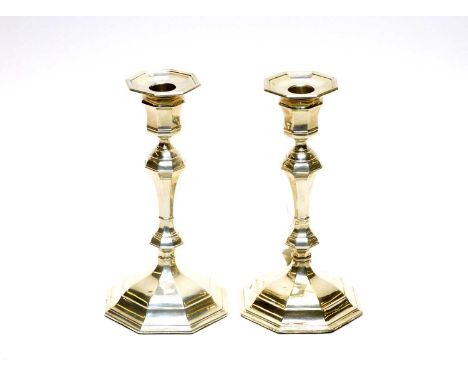 A pair of silver candlesticks, by William Hutton &amp; Sons Ltd, London 1907, of octagonal form with loaded bases.